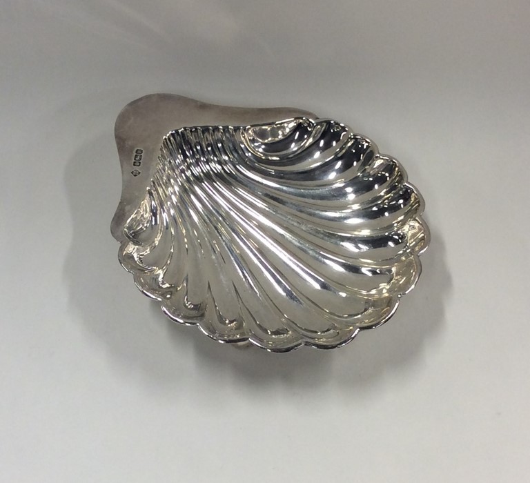 An Edwardian silver butter shell on ball feet. She - Image 2 of 3