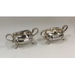 A pair of Edwardian silver salts with reeded decor