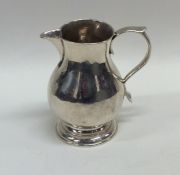 A good Georgian silver sparrow beak cream jug on s