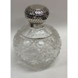A silver mounted hobnail cut scent bottle. Est. £3