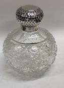 A silver mounted hobnail cut scent bottle. Est. £3