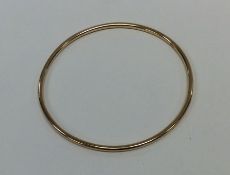 A 9 carat plain bangle. Approx. 11 grams. Est. £12