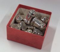 A box containing Sterling silver peppers. Approx.