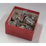 A box containing Sterling silver peppers. Approx.