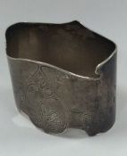 A heavy Russian silver napkin ring decorated with