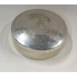 A circular silver dome top Chinese box engraved wi