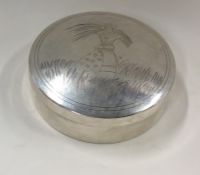 A circular silver dome top Chinese box engraved wi