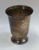 A tall tapering French silver spill vase on spread