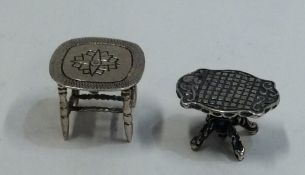 A miniature silver doll's house table together wit