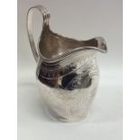 A good Georgian bright cut silver cream jug with r