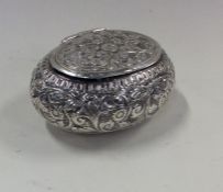 An unusual Persian silver tobacco pouch with hinge