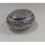 An unusual Persian silver tobacco pouch with hinge