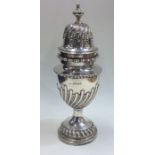 A massive Victorian silver half fluted sugar caste