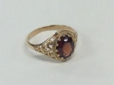 A 9 carat garnet single stone ring. Approx. 2.3 gr