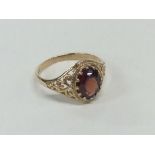 A 9 carat garnet single stone ring. Approx. 2.3 gr