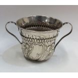 A silver George I half fluted porringer with reede