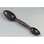 A novelty double ended silver medicine spoon with