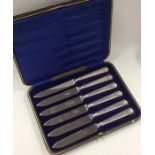 A boxed set of six silver handled tea knives. Appr