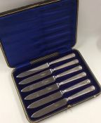 A boxed set of six silver handled tea knives. Appr