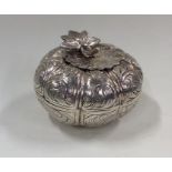 An Islamic silver box and cover in the form of a f