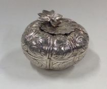 An Islamic silver box and cover in the form of a f