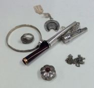 A silver mounted cigarette holder together with ot