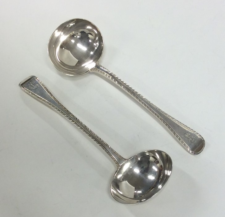 A good pair of feather edge silver ladles. London.