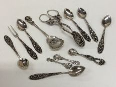 A set of six silver mounted coffee spoons together