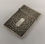 An Indian silver card case profusely decorated wit