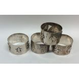 A heavy set of four Chinese silver napkin rings. A