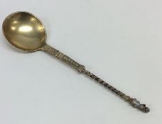A silver gilt preserve spoon with twisted stem and