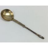 A silver gilt preserve spoon with twisted stem and