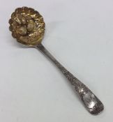 A good Georgian silver berry sugar ladle decorated