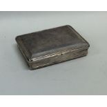 A heavy rectangular silver snuff box with hinged t