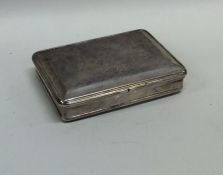 A heavy rectangular silver snuff box with hinged t