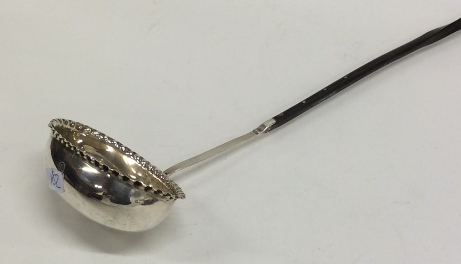 A Georgian silver toddy ladle with crimped rim. Ap - Image 2 of 2