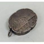 A rare Victorian silver oval vinaigrette with scro