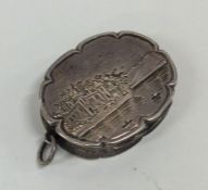 A rare Victorian silver oval vinaigrette with scro