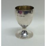 A miniature Georgian silver goblet with gilt inter