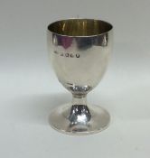 A miniature Georgian silver goblet with gilt inter