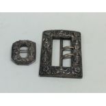 Two heavy cast silver Indian buckles. Approx. 60 g