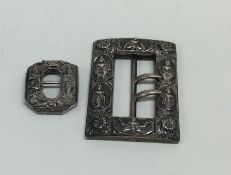 Two heavy cast silver Indian buckles. Approx. 60 g