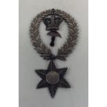 An unusual Masonic silver pendant with laurel wrea