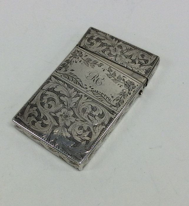 An attractive Victorian silver card case profusely