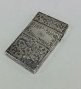 An attractive Victorian silver card case profusely