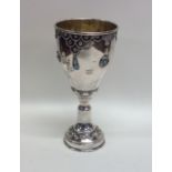 An Eastern silver cup attractively decorated with