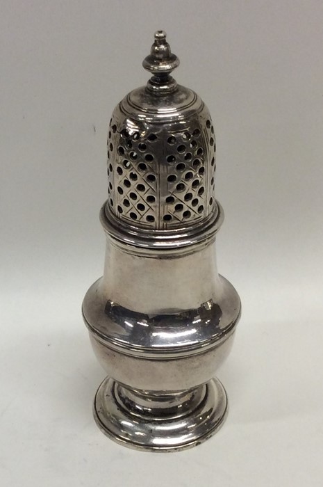 A small Georgian silver baluster shaped caster. Lo