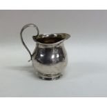 A small silver Georgian style cream jug. Approx. 2