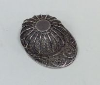 An Antique silver filigree jockey cap caddy spoon.