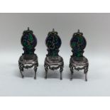 An attractive set of three plique-à-jour chairs wi